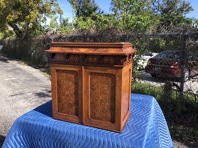 Antique burl cabinet repaired
and restored