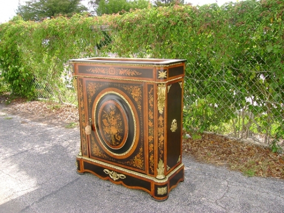 Inlaid commode with brass hardware repaired and restored as original as possible